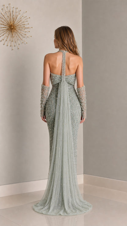 Back view of sage green evening gown showing open back and cape train