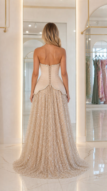 Back view showing lace-up corset detail on champagne gown