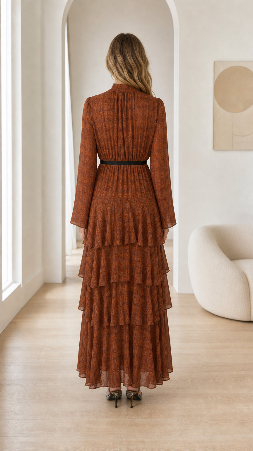 Back view of woman in Rust Brown pleated tiered evening maxi dress