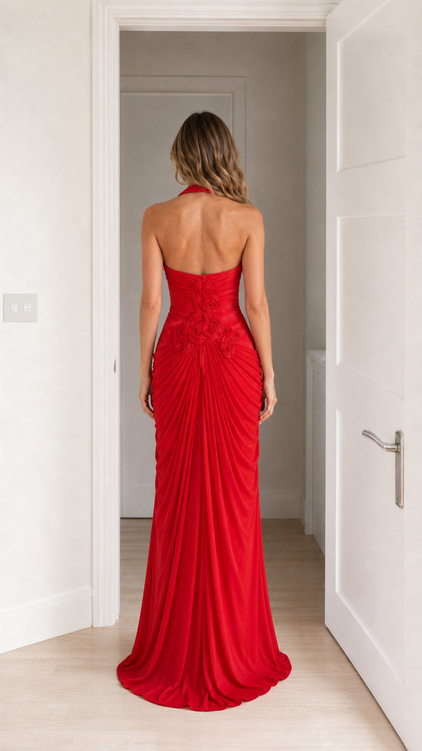 Back view of model in red halter neck maxi dress