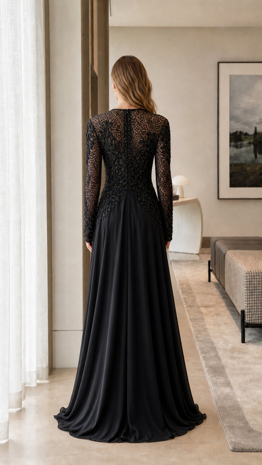 Back view of model showing the detailed lace back of the black maxi dress