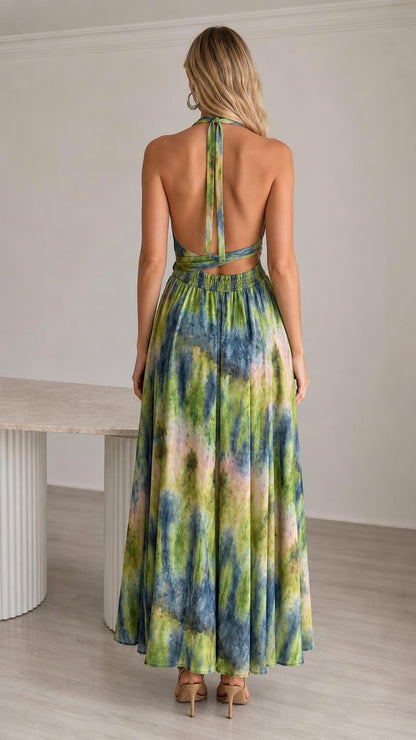 Back view showing open back design of the green tie-dye jumpsuit