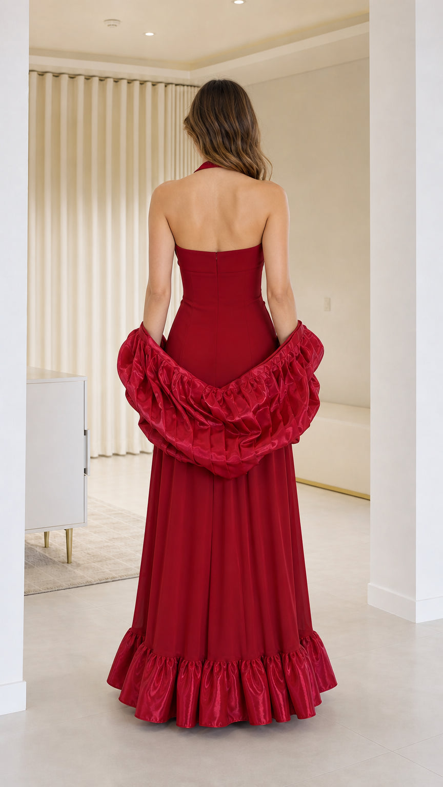 Back view of red evening dress showing backless cut and shawl
