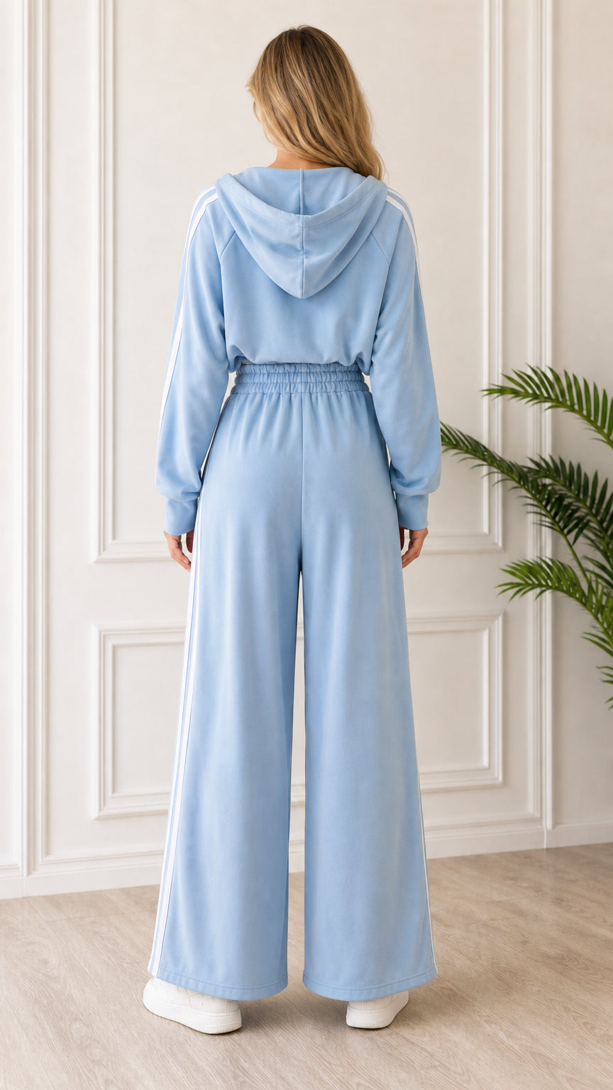 Back view of woman wearing Light Blue hooded loungewear set showing wide leg pants and hood