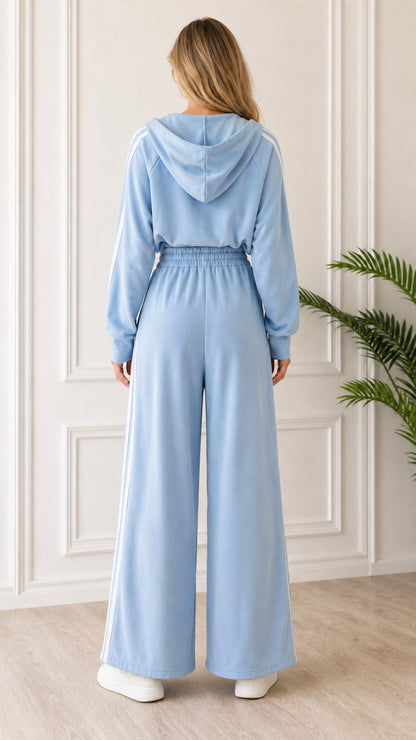 Back view of woman wearing Light Blue hooded loungewear set showing wide leg pants and hood