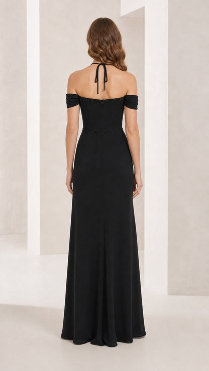 Back view of black formal gown with halter tie