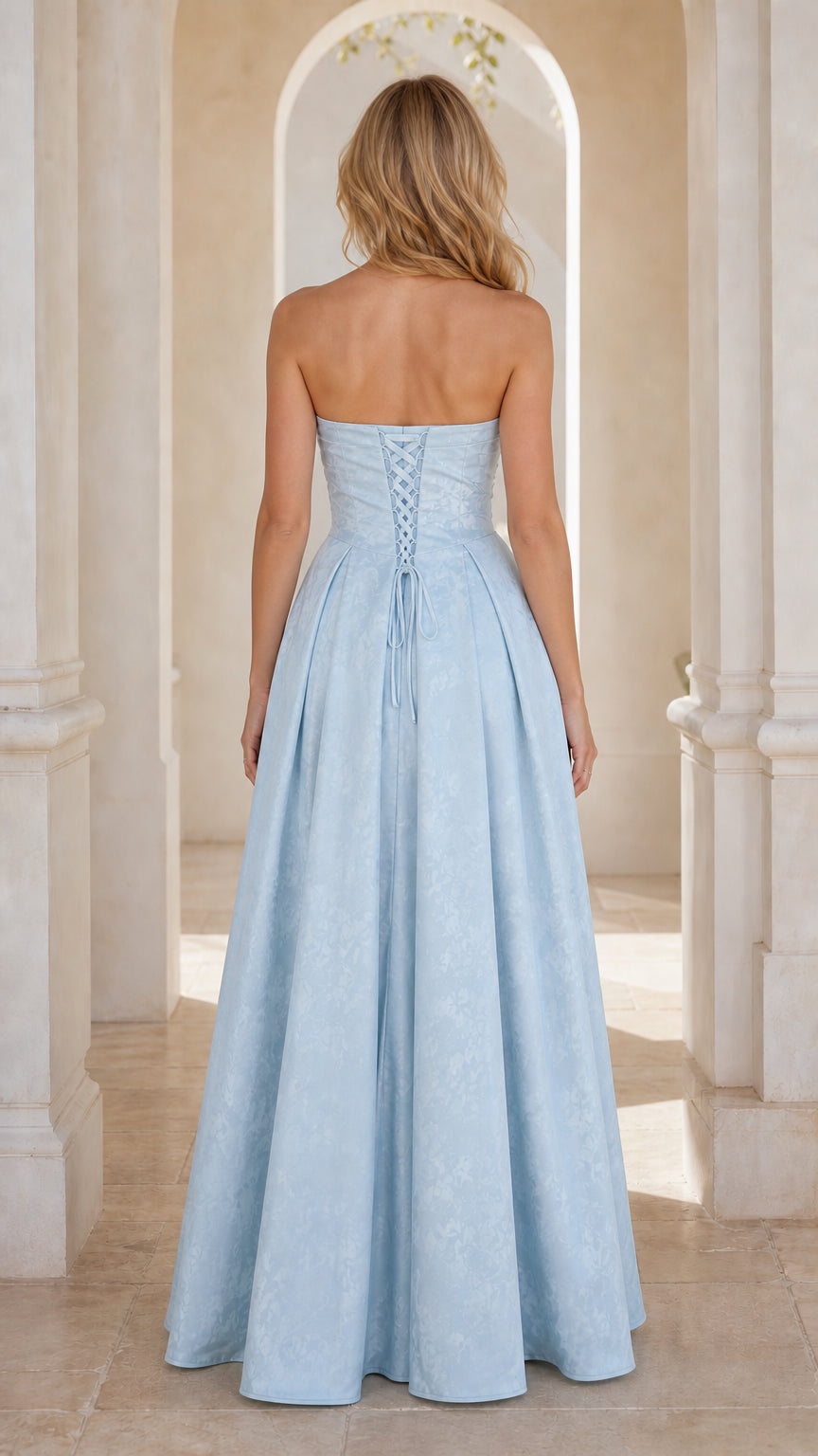 Back view of light blue gown showing lace-up corset closure