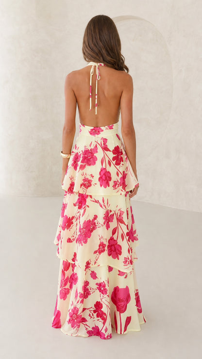 Back view showing tie straps of yellow floral maxi dress
