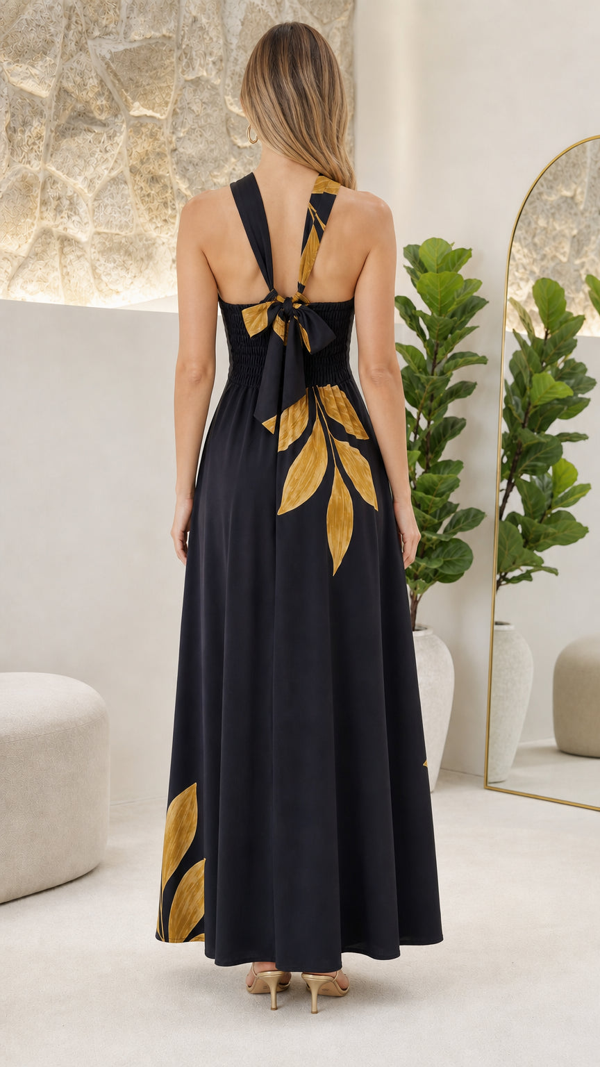 Back view showcasing crossed straps and tie detail of the Black dress