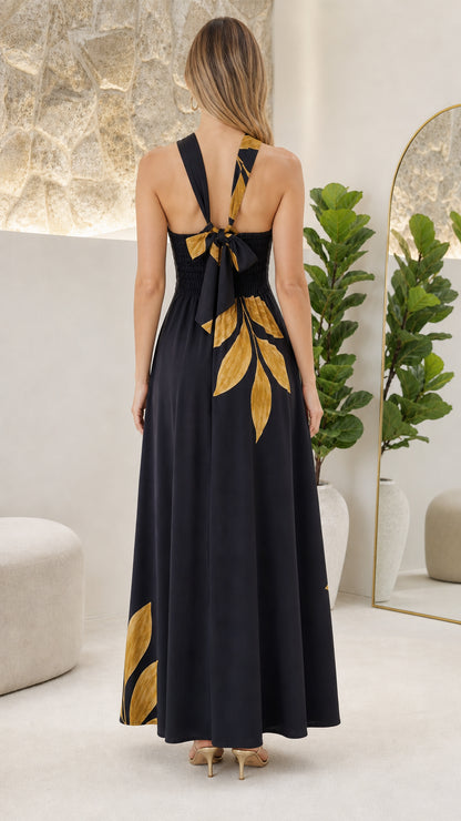 Back view showcasing crossed straps and tie detail of the Black dress
