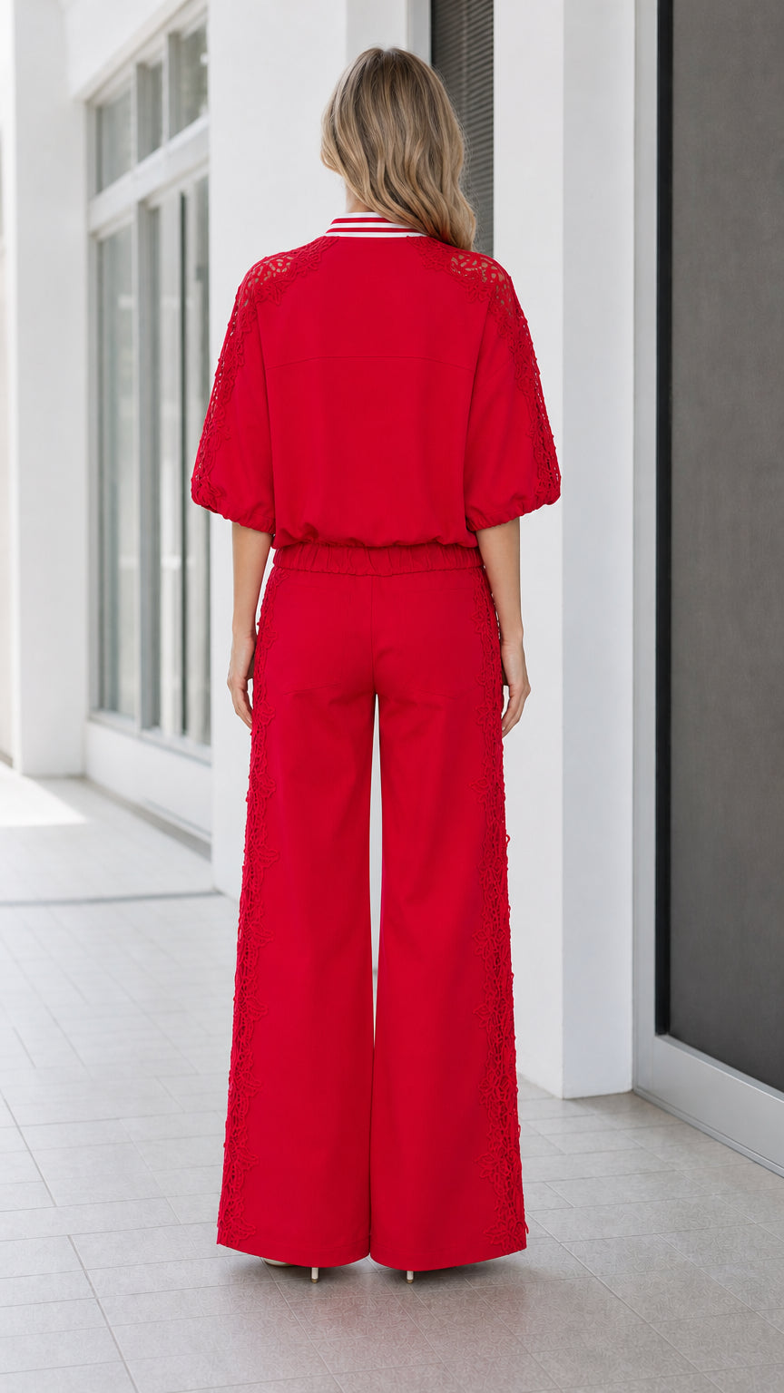 Back view of women's red short-sleeve bomber and wide-leg pant set