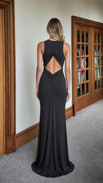 Back view of black maxi dress showing cutout and strap details