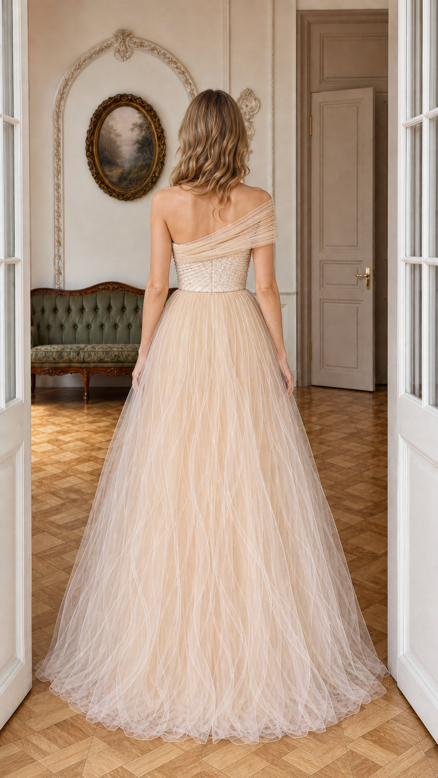 Back view of model in champagne floor-length tulle formal dress