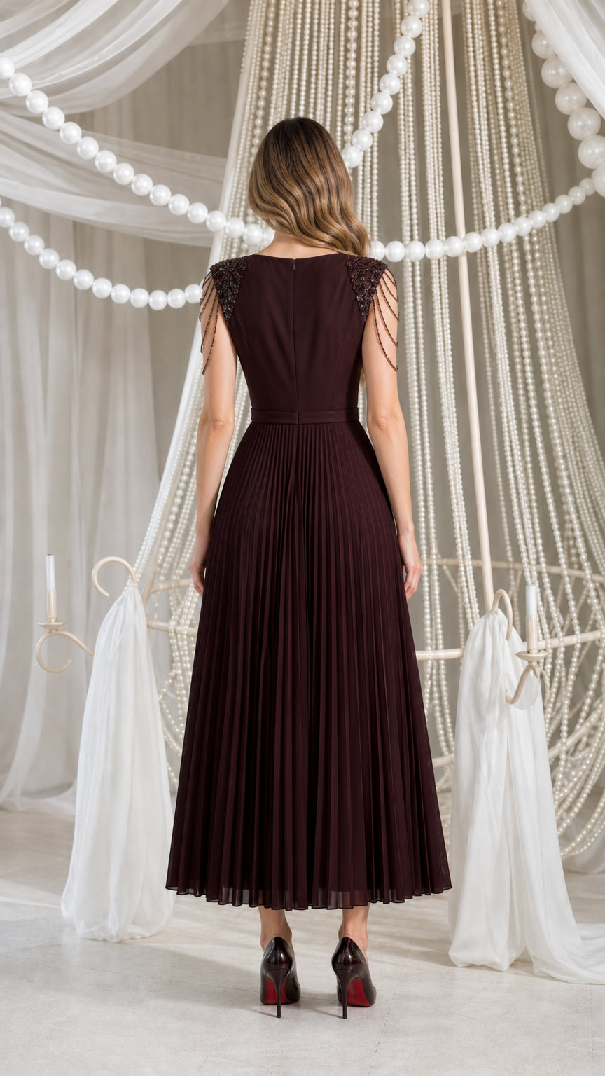 Back view of burgundy pleated midi dress