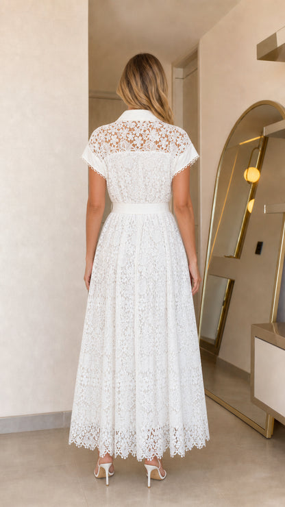 Back view of woman wearing white lace maxi dress