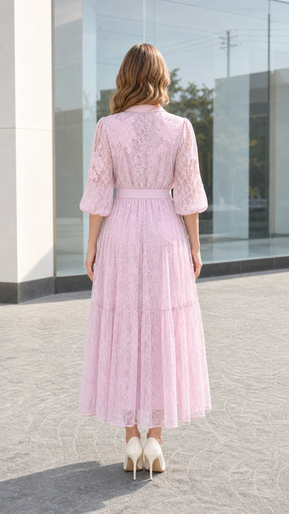 Back view of blush pink floral lace midi dress highlighting waist fit and sleeve shape