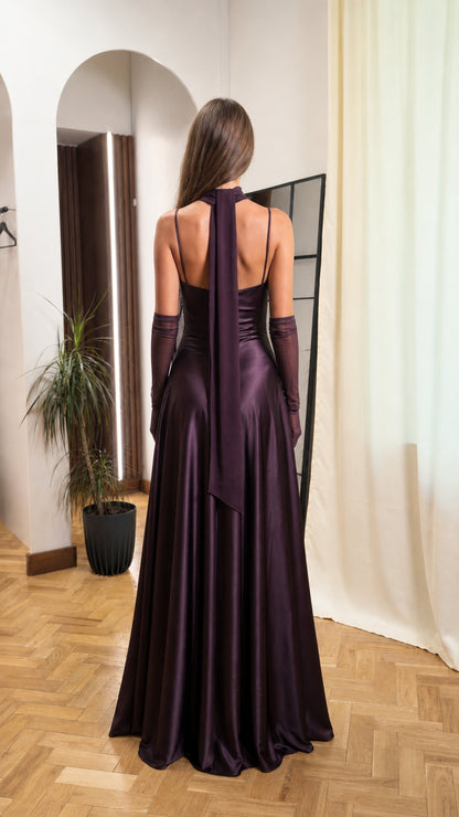Back view of woman showing halter neck tie on plum maxi dress