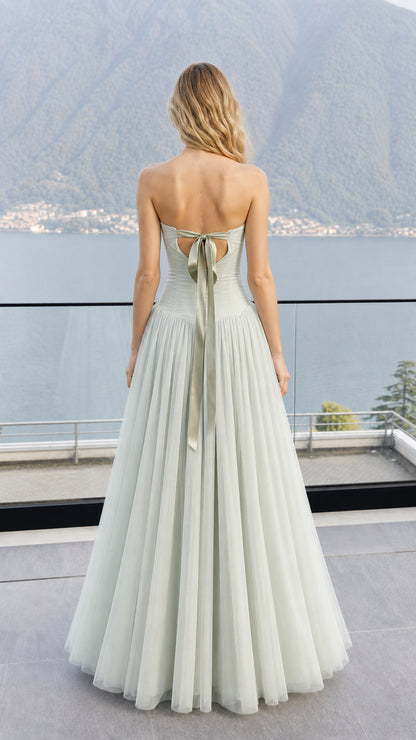Back view showcasing ribbon tie detail on sage green maxi dress