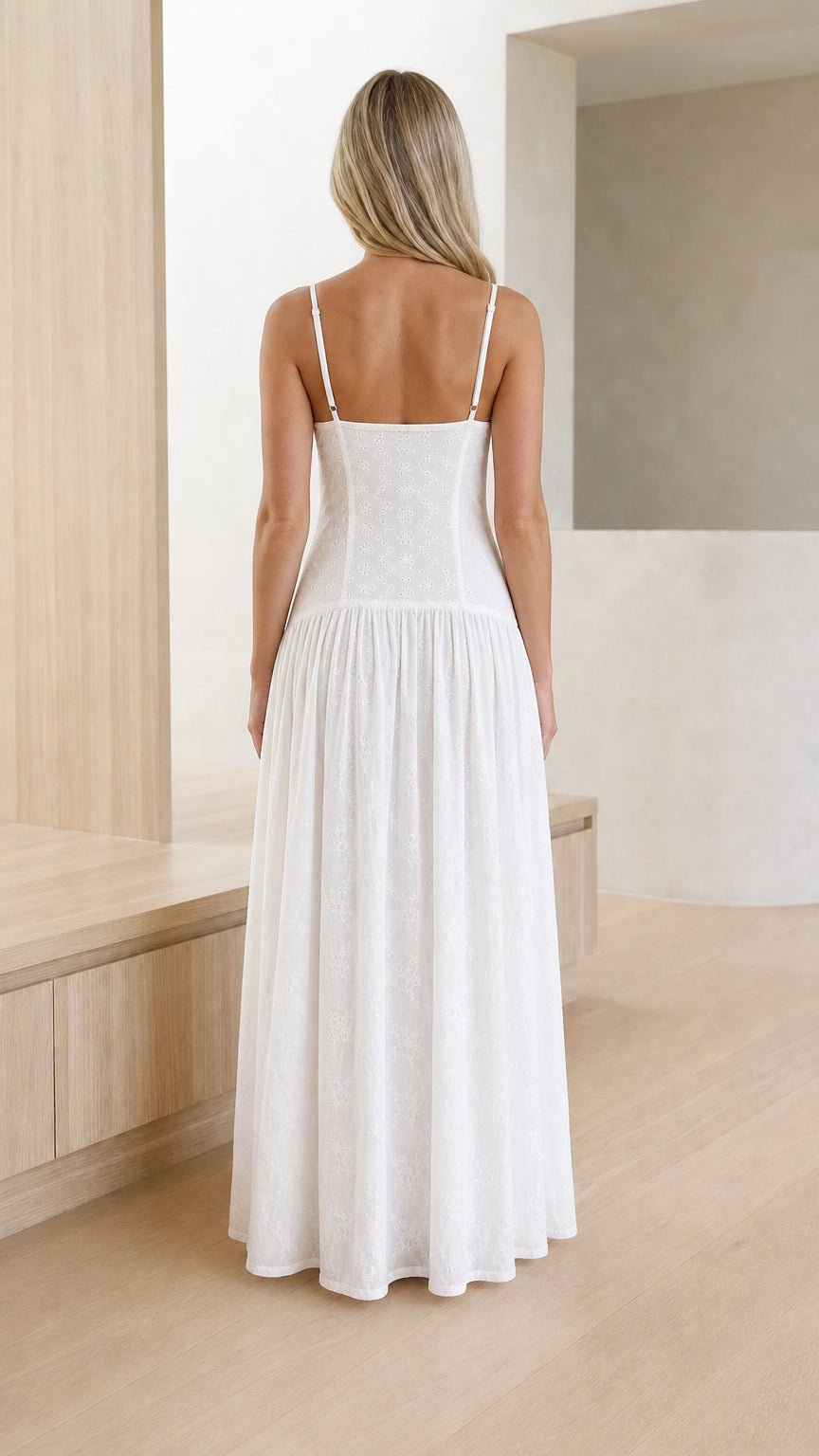 Back view of white spaghetti strap drop-waist embroidered maxi dress