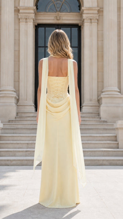 Back view of model showing lace-up corset back and draped scarf detail on yellow dress
