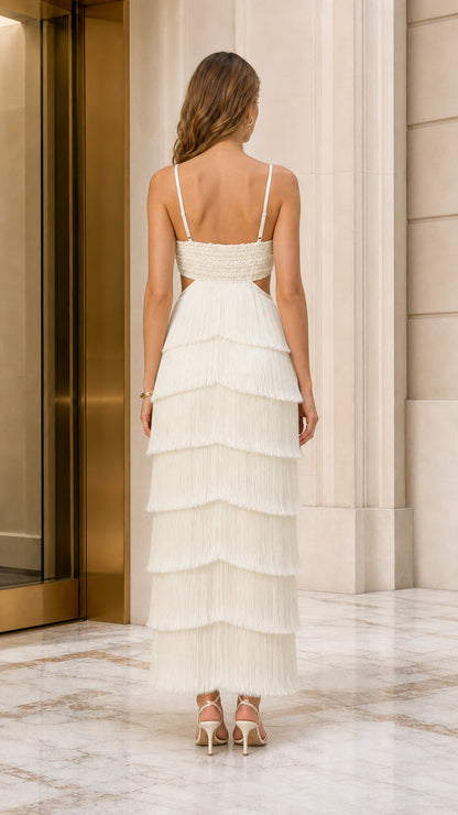 Back view of ivory cutout fringe maxi gown showing strappy open-back detail