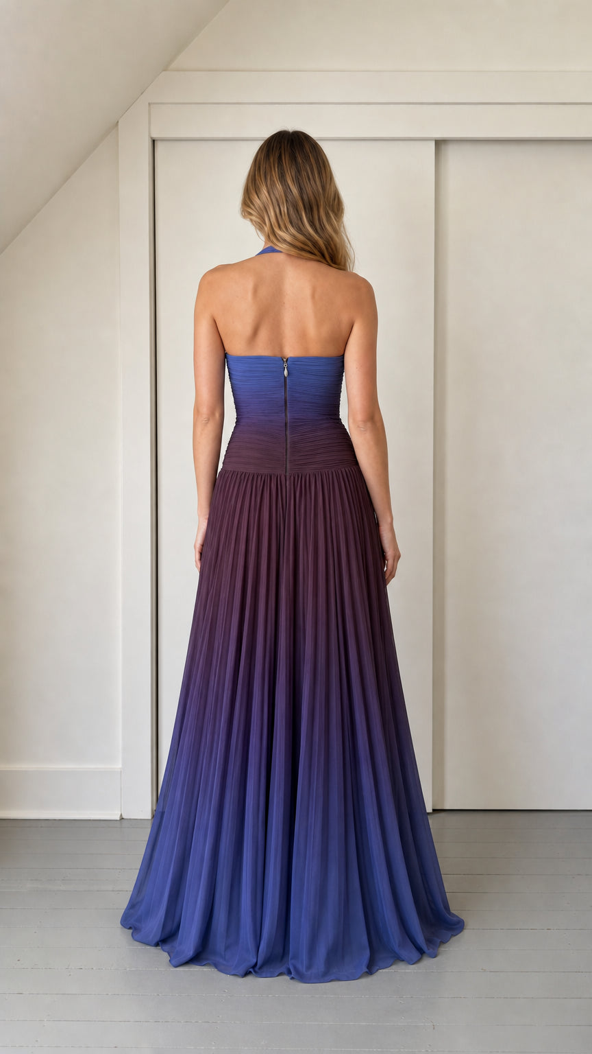 Back view showing zipper and pleated skirt detail