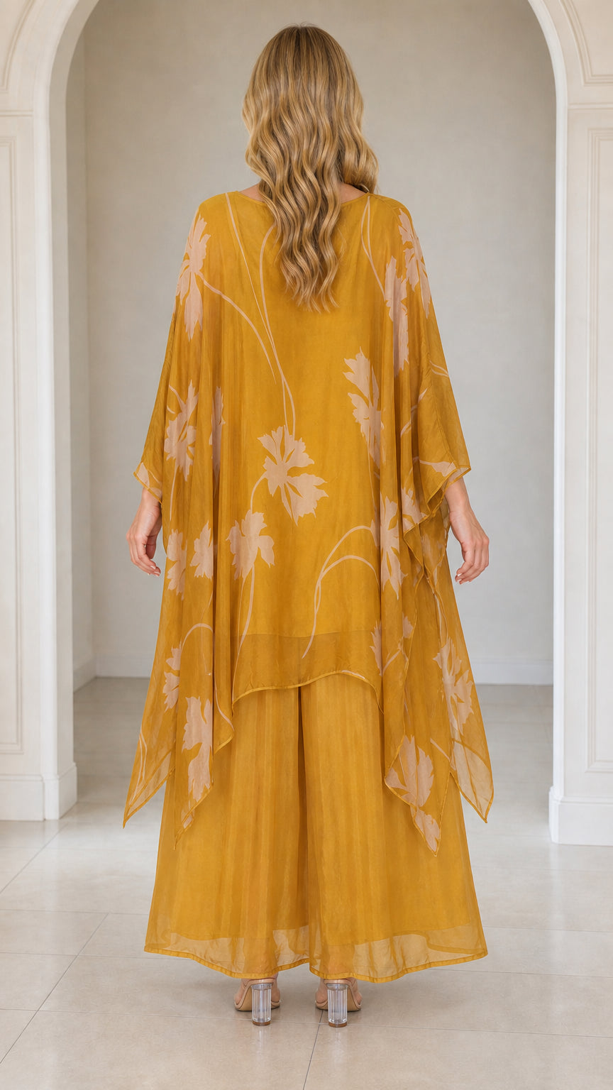 Back view of woman wearing mustard yellow layered kaftan set