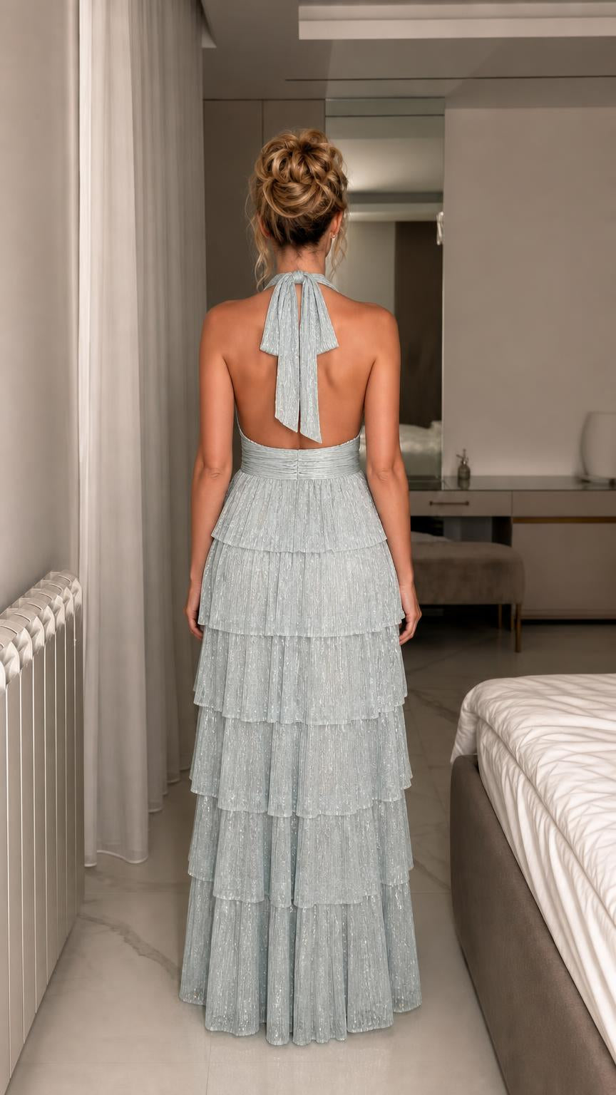 Back view showcasing open back and halter tie of light blue gown