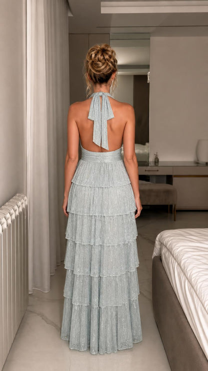 Back view showcasing open back and halter tie of light blue gown