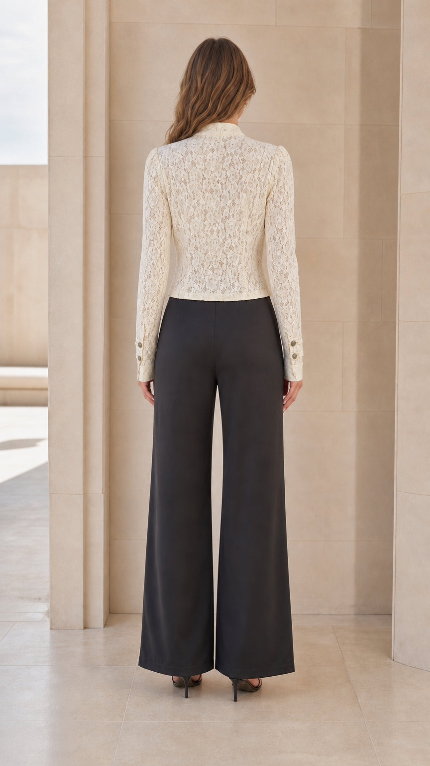 Back view of woman wearing ivory lace jacket