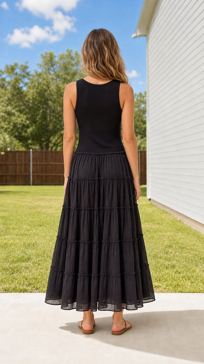 Back view of woman wearing Black sleeveless tiered maxi dress