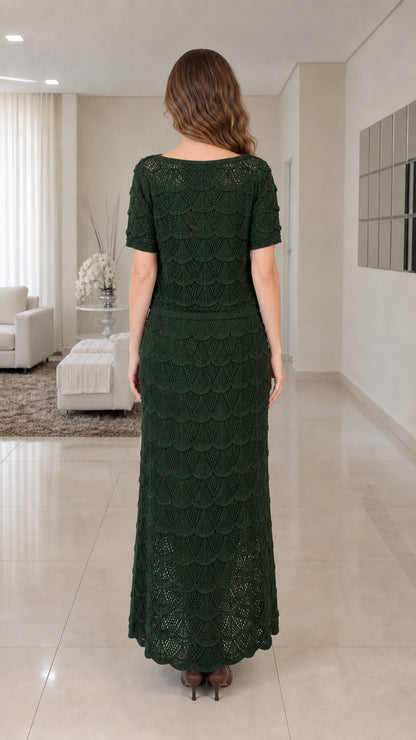 Back view of woman wearing dark green knit maxi dress