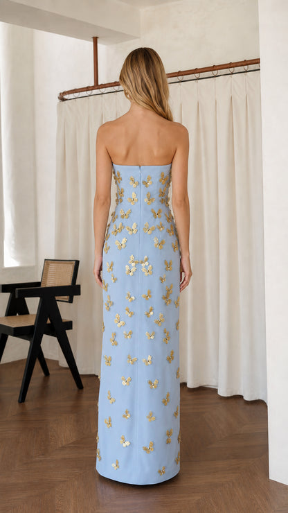 Back view of light blue strapless maxi dress with zipper detail