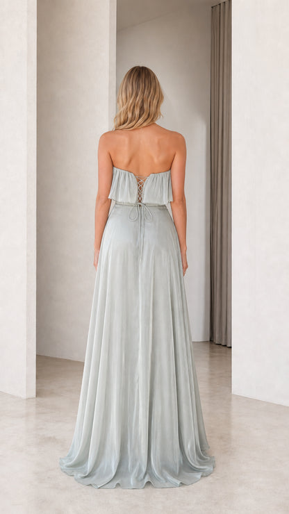 Back view showing lace-up closure of the sage green dress