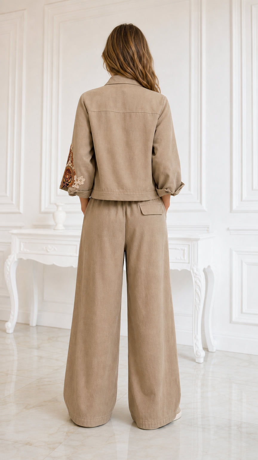 Back view of model wearing khaki matching jacket and wide-leg trousers