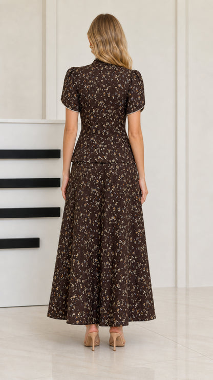 Back view of woman wearing dark brown floral maxi skirt and top set