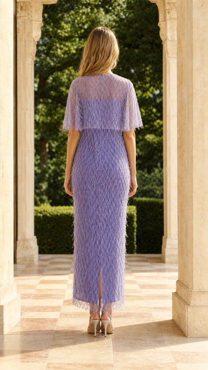 Back view of model showing split hem detail in lavender dress