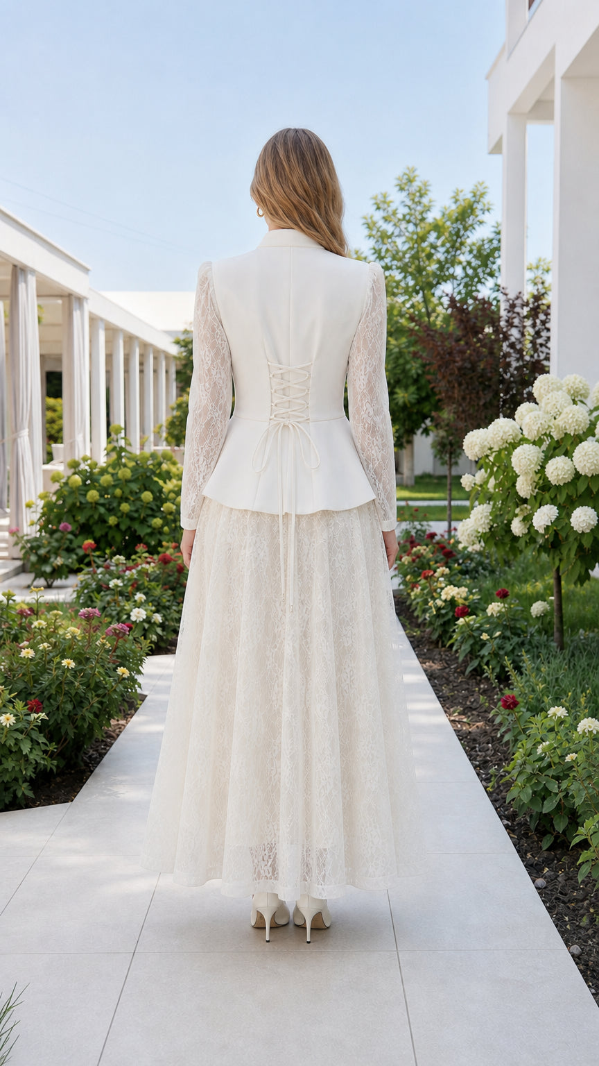 Back view showing lace-up detail on white peplum top