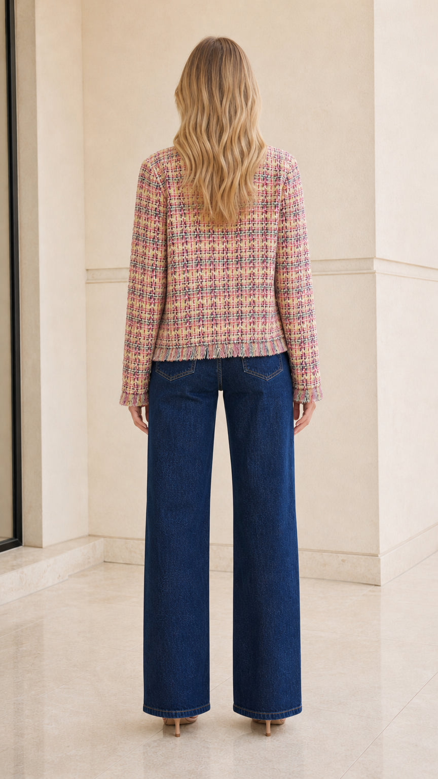 Model wearing multi pink tweed jacket back view