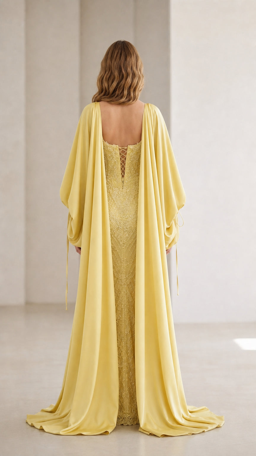 Back view of yellow evening gown showing corset-style lace-up back detail