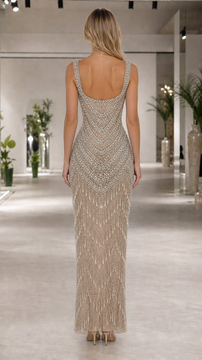 Back view of champagne beaded maxi gown with low scoop neckline