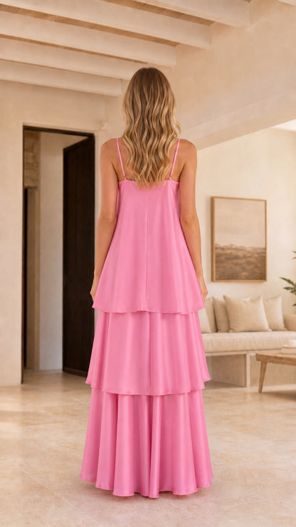 Back view of model showing straps and tiered layers of pink maxi dress