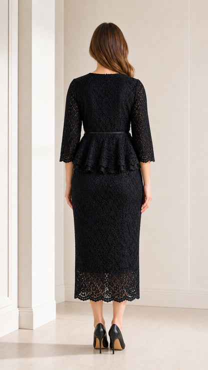 Back view of woman wearing black floral lace peplum midi dress