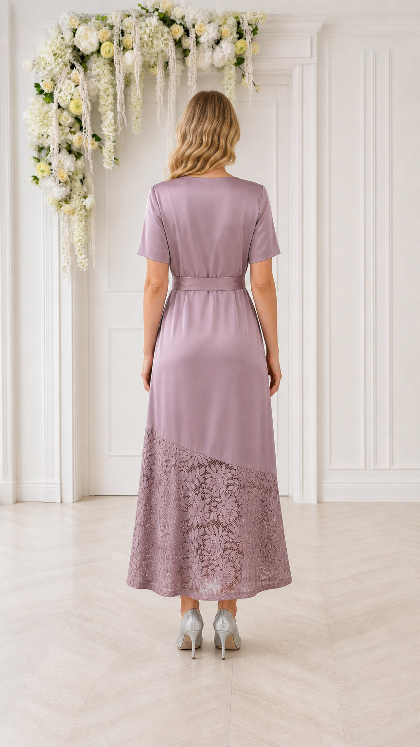 Model wearing mauve lace-trimmed midi dress, back view