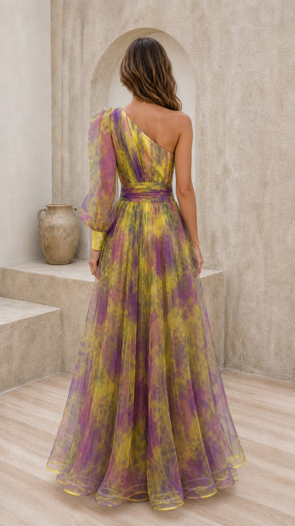 Back view of yellow multi one-shoulder gown with voluminous sleeve