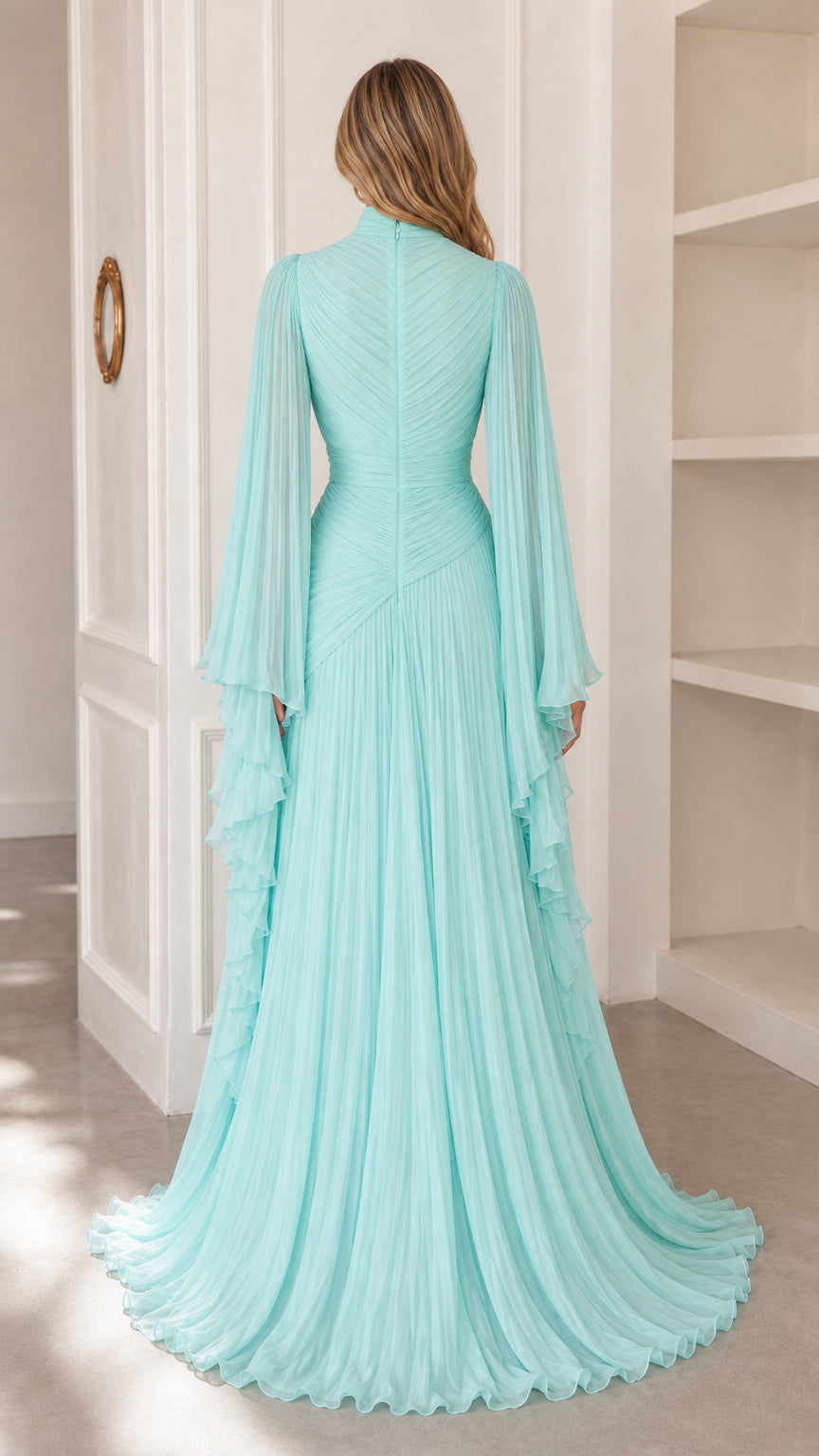 Back view of model showing the flowing silhouette of aqua blue pleated maxi gown