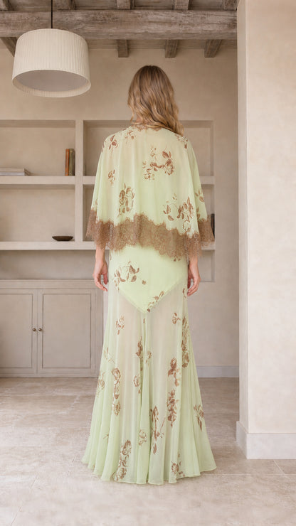 Model wearing mint green floral maxi dress, back view