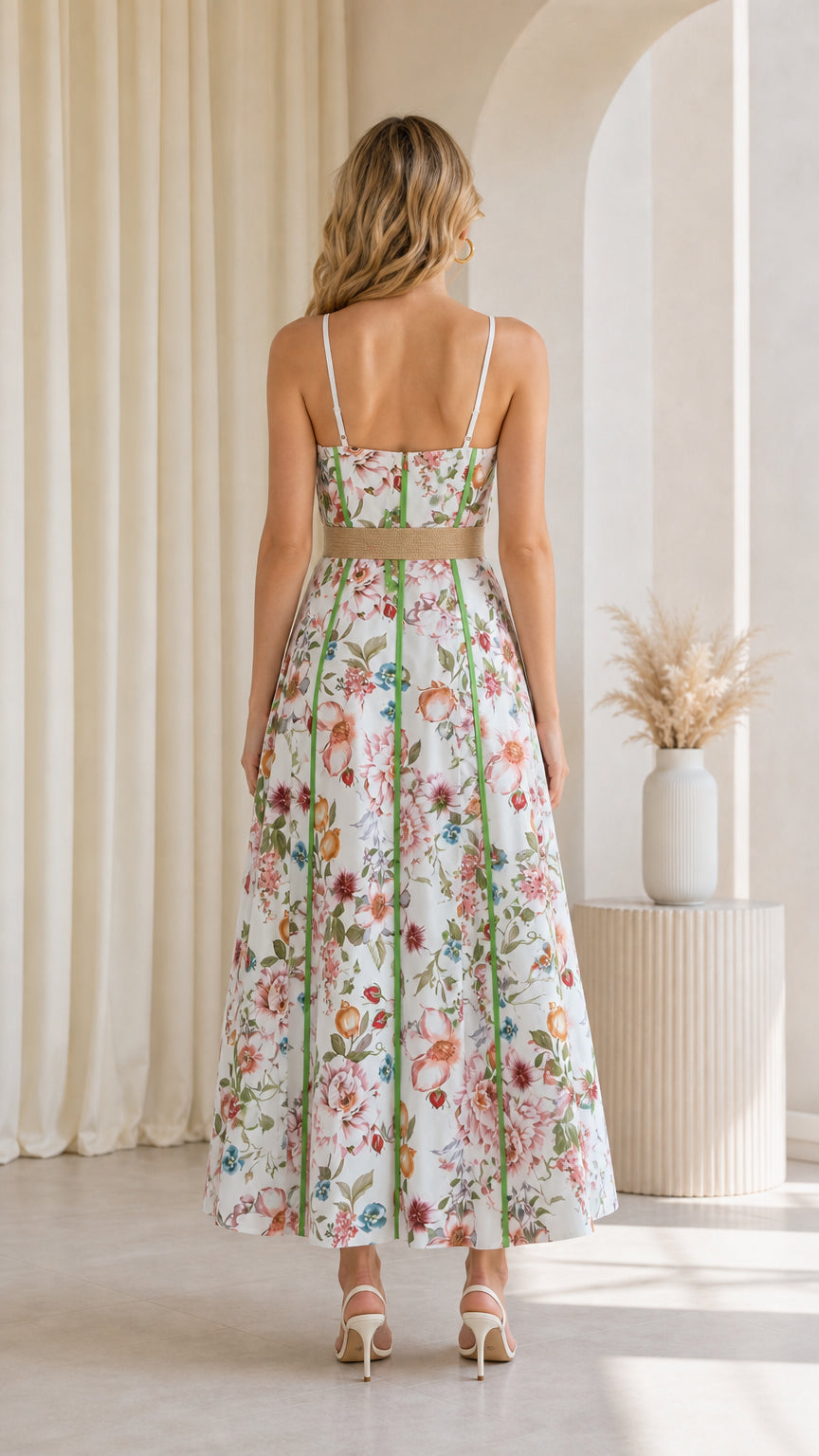 Back view of model in white floral maxi dress