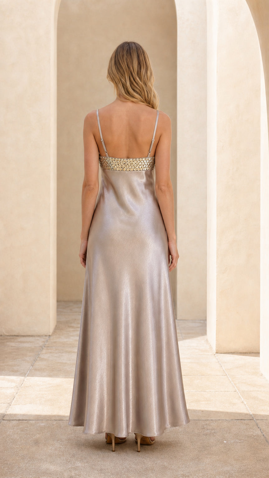 Back view of champagne sequin satin maxi dress showing straps