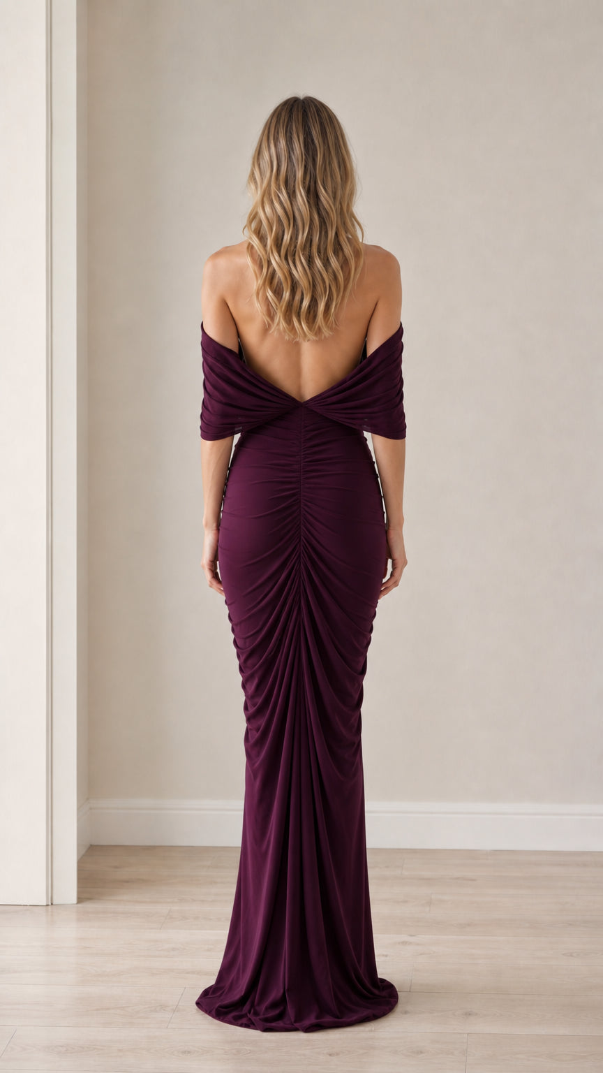 Back view showcasing the open back and draping